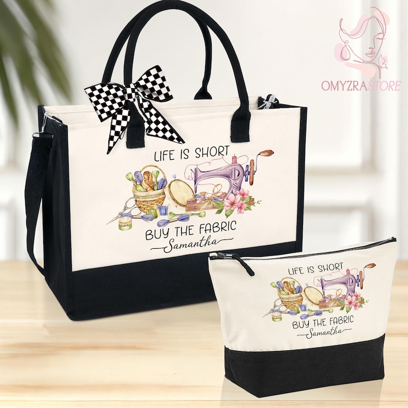 May include: A black and white tote bag and matching cosmetic bag. Both bags have a white background with a sewing-themed illustration and the text "LIFE IS SHORT BUY THE FABRIC Samantha". The tote bag has a black and white checkered bow.