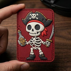 May include: A red rectangular patch featuring a cartoon pirate skeleton with a black hat, red bandana, and a sword. The skeleton holds a bottle and the text "PREMIUM EDITION" is visible.