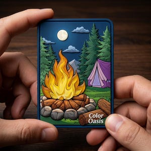 May include: A rectangular patch with a camping scene. A campfire with orange and yellow flames is in the foreground, with a purple tent, trees, and a full moon in the background. The text "Color Oasis" is in the lower right corner.