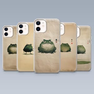 May include: A collection of five phone cases featuring watercolor illustrations of frogs. Each case showcases a different frog design in shades of green and brown, set against a vintage paper background. The cases are clear, allowing the phone's color to show.