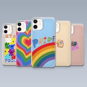 May include: Five phone cases with different designs. One features a rainbow heart, another has the word "PRIDE" over a rainbow, and another says "NOT A PHASE" on an envelope. The other two cases have floral and sandwich designs.