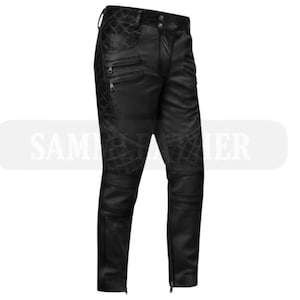 May include: Black leather pants with quilted diamond pattern details on the thighs and upper legs. The pants have multiple zippered pockets and zippers at the ankles. The pants are designed with a classic five-pocket style.