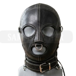 May include: A black leather hood with white stitching, eye and mouth openings, and a metal ring on the mouth. The hood includes a neck collar with a buckle and metal rings. The product is designed for role-playing.