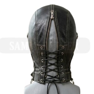 May include: Black leather hood with a zip at the back and a lace-up fastening. The hood features visible stitching and a textured finish. The design includes a neck piece with metal eyelets for the laces.