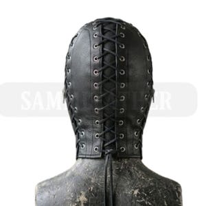 May include: Black leather hood with a lace-up design. The hood covers the entire head and neck, with eye and mouth openings. The back of the hood features a vertical lace-up closure. The hood is on a mannequin.