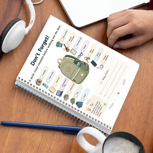 May include: A spiral-bound checklist titled Don't Forget! featuring a central illustration of a green backpack surrounded by icons for items like a lunchbox, water bottle, sports uniform, musical instrument, glasses, keys, phone, and charger.