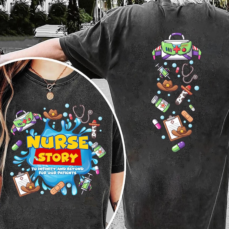 May include: Dark gray t-shirt with a colorful graphic design. The front features the words "NURSE STORY" in yellow and red, with medical-themed illustrations. The back has similar medical-themed graphics, including a medical bag and a stethoscope.