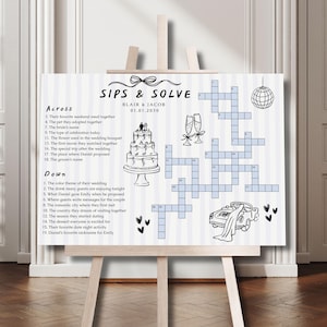 Peut inclure: Un jeu de mots croisés sur le thème du mariage, intitulé "Sips & Solve", sur un chevalet. Le design en noir et blanc comprend un gâteau, des flûtes à champagne, une boule disco et une voiture. La date est le 01.01.2030.