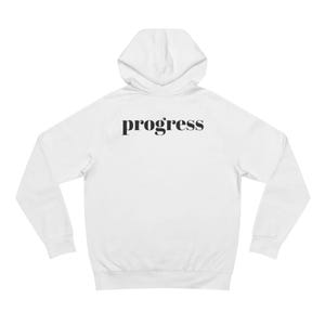 May include: White hoodie with the word "progress" printed in black across the back. The hoodie has a hood and long sleeves. The garment is made of a soft material.