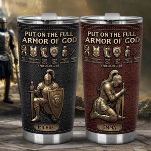 May include: Two stainless steel travel tumblers with a leather-like texture. One is black, the other is brown. Both feature the text "PUT ON THE FULL ARMOR OF GOD" and illustrations of armor pieces. The black tumbler says "MICHAEL" and the brown one says "EMMA".