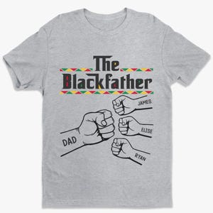 May include: A gray t-shirt with the text "The Blackfather" above four clenched fists. The names "James", "Elise", and "Ryan" are written below three of the fists, and "Dad" is written below the fourth fist.