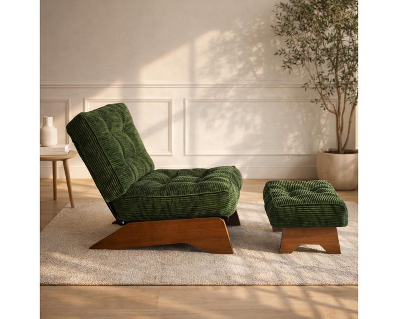 May include: A green corduroy lounge chair and matching ottoman set. The chair has a tufted back and seat, and both pieces have wooden bases. The set is placed on a light-colored rug.