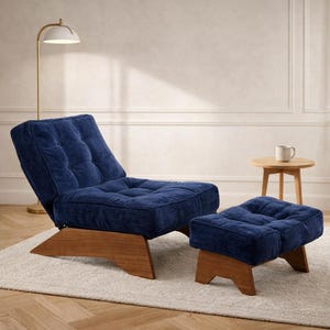 May include: A navy blue corduroy lounge chair and ottoman set. The chair has a tufted back and seat, and both pieces have wooden bases. A small side table and a floor lamp are also in the image.