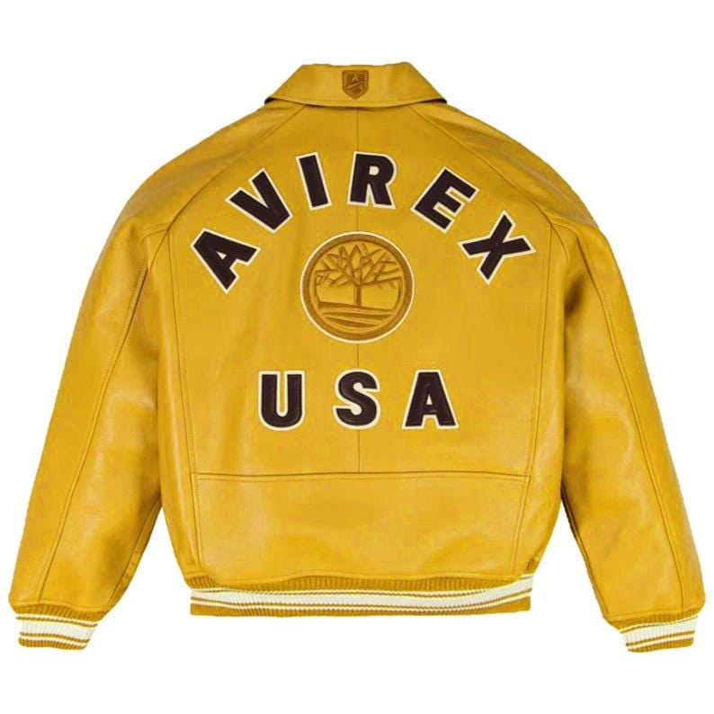 May include: Mustard yellow leather jacket with the text "AVIREX USA" on the back. The jacket has a ribbed collar and cuffs with white and tan stripes. A logo is centered above the text.