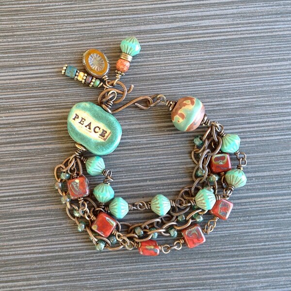 Rustic Boho Multi-Strand Brass Bracelet with Green Ceramic "Peace" Bead, Czech Glass in Turquoise Green and Rust, Seed Beads, Brass Chains