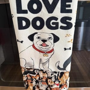 I Love Dogs! Adorable dogs are on this 100% polyester tea towel along with cartoon dogs on the cotton trim. Absorbent and soft and cute!