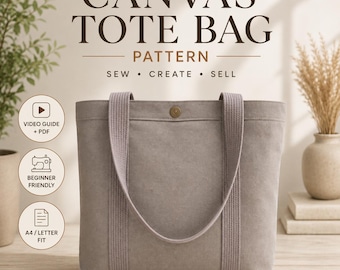 Puede incluir: Un bolso tote de lona gris con dos asas de tela a juego y un cierre de botón a presión central. El texto superior dice CANVAS TOTE BAG PATTERN SEW CREATE SELL, con iconos circulares que indican guía de video, PDF, apto para principiantes y tamaño A4/carta.