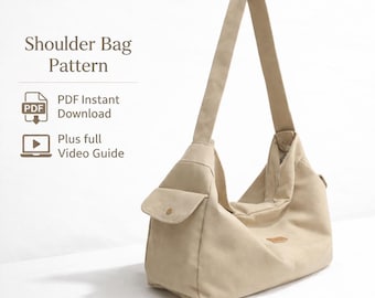 Puede incluir: Un bolso de hombro beige con una correa larga, un bolsillo delantero y un pequeño parche. La bolsa está hecha de lona. El texto "Shoulder Bag Pattern" está en la parte superior, con "PDF Instant Download" y "Plus full Video Guide" debajo.
