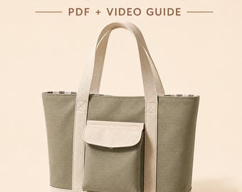 Puede incluir: Un bolso tote de lona en color verde salvia y crema con un bolsillo frontal 3D con solapa, dos asas resistentes y una base reforzada. El texto 3D POCKET TOTE PDF + VIDEO GUIDE aparece sobre el bolso en letras negras y marrones.
