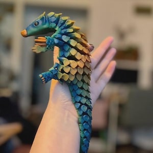 May include: A set of three ceramic mugs with a speckled, matte finish. The mugs are in shades of cream, light gray, and dark gray. Each mug has a simple, minimalist design, perfect for coffee or tea.