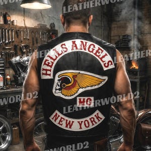 May include: A black leather vest featuring a large embroidered patch on the back with the text HELLS ANGELS in a red arc, a central winged skull emblem, the letters MG in a red box, and the text NEW YORK in a red arc at the bottom.