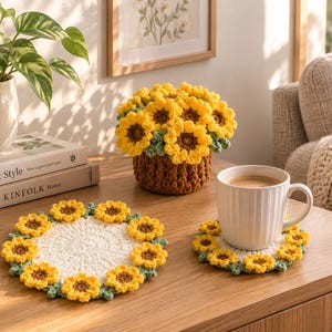 May include: A crochet sunflower arrangement in a brown pot, a large circular white crochet coaster with a sunflower border, and a smaller circular white crochet coaster with a sunflower border holding a white ribbed ceramic coffee mug.