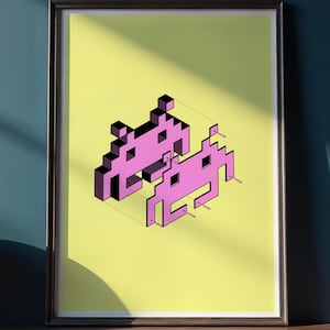 May include: Framed art print featuring two pixelated pink space invader figures on a yellow background. The artwork is displayed on a wooden shelf with a globe and several glass bottles with cork stoppers. The wall is painted a dark teal color.