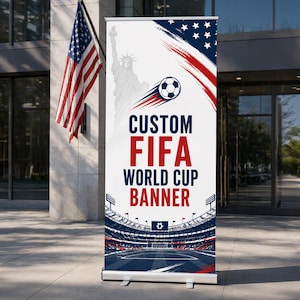 May include: A custom FIFA World Cup banner with a soccer ball graphic, the Statue of Liberty, and the American flag. The banner is white with red and blue accents, and a stadium graphic at the bottom.