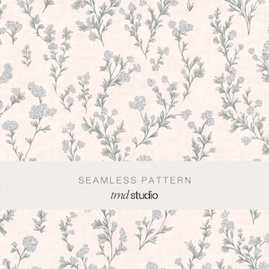 May include: A seamless pattern featuring delicate grey botanical illustrations of small flowers and leafy stems scattered across a pale pink background. A white horizontal band across the centre displays the text SEAMLESS PATTERN and trnd studio.