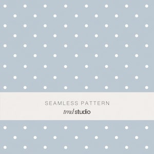 May include: A seamless pattern featuring a light blue background with evenly spaced white polka dots. A white rectangular banner across the image displays the text "SEAMLESS PATTERN" and "tmd studio".