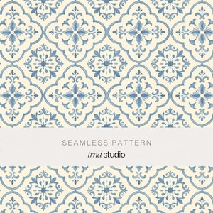 May include: A seamless pattern featuring a repeating blue and cream floral tile design. The graphic displays intricate symmetrical motifs within curved geometric shapes. A horizontal white band across the centre contains the text SEAMLESS PATTERN trnd studio.