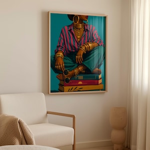 May include: A framed wall art print depicting a person wearing a pink and blue striped button-down shirt and teal trousers, adorned with multiple gold necklaces, bracelets, and rings, sitting on a stack of three books while holding round sunglasses.