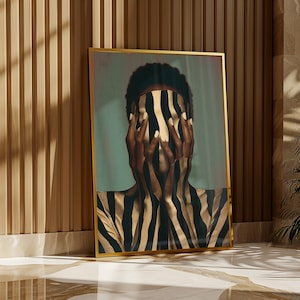 May include: A framed vertical wall art print featuring a person with dark skin covering their face with hands, both adorned with a bold black and gold vertical striped pattern that extends across the torso, set against a muted teal background.