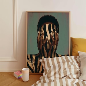 May include: A framed vertical wall art print featuring a person with dark skin covering their face with hands, both adorned with vertical black and gold stripes. The background is a muted teal color, and the artwork is displayed in a light wood frame.