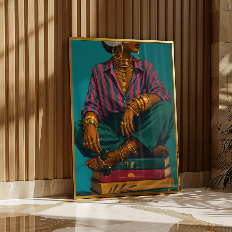 May include: A framed wall art print depicting a figure in a pink and blue striped shirt and teal trousers, adorned with multiple gold necklaces and bracelets, sitting on a stack of three books while holding a pair of round sunglasses.