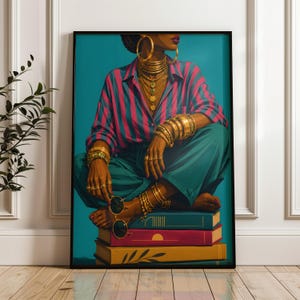 May include: A framed art print depicting a person wearing a pink and blue striped button-down shirt and teal trousers, adorned with multiple gold hoop earrings, layered necklaces, and stacked gold bracelets, sitting atop a stack of three books.