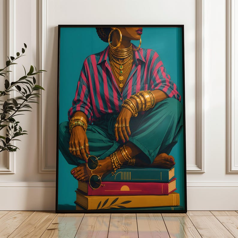 May include: A framed art print depicting a person wearing a pink and blue striped button-down shirt and teal trousers, adorned with multiple gold hoop earrings, layered necklaces, and stacked gold bracelets, sitting atop a stack of three books.