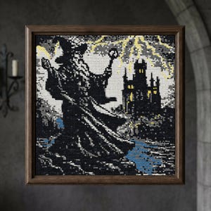 May include: A framed cross-stitch depicting a wizard figure with a staff, standing before a castle under a stormy sky. The artwork features a dark color palette with yellow lightning bolts and a blue river. The frame is made of wood.