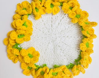 Handmade-knitted coasters with yellow flowers and handmade-knitted basket