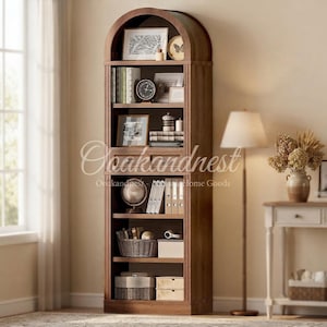 May include: A tall, arched wooden bookcase with six shelves filled with books, framed pictures, a round clock, a globe, woven baskets, and storage boxes. The unit features a warm brown wood grain finish and a decorative top arch design.