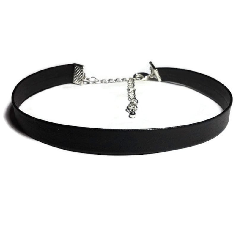 May include: A black faux leather choker necklace with a silver chain and clasp.