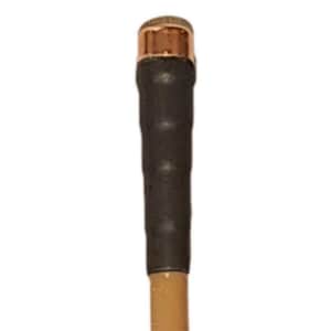 May include: A close-up of a walking stick. The top is capped with a gold-colored metal. The handle is wrapped in dark brown material. The shaft is a light brown color.