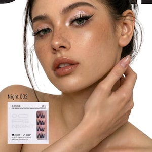 May include: A woman with makeup, including eyeliner and eyeshadow, is featured in a beauty product advertisement. The product is a set of CORE PRE NIGHT self-adhesive eyelashes, labeled "Night 002". The packaging includes the number 24.