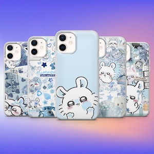 以下が含まれることがあります： 様々なデザインのスマートフォンケース5個セット。主に水色を基調とし、ウサギの漫画イラスト、星、花柄が描かれています。一部のケースには「Tomnga Cute one 11」と「smile wn」の文字が書かれています。