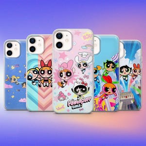 May include: A collection of five phone cases featuring colorful designs from the Powerpuff Girls cartoon. Each case has a different design, including characters, stars, and the text "Powerpuff Girls". The cases are in various colors, including blue, pink, and green.