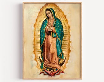May include: A framed print of Our Lady of Guadalupe featuring a figure in a teal mantle with gold stars over a rose-colored gown, standing on a crescent moon supported by an angel, surrounded by a radiant golden sunburst on a cream background.