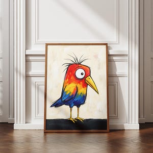 May include: A framed wall art print featuring a stylized bird with a vibrant red, orange, and yellow head, a large white eye, a yellow beak, and blue wings. The bird has spiky black feathers on its head and stands on thin yellow legs.