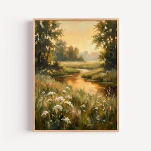 May include: A vertical rectangular wall art print featuring an oil painting of a serene landscape. A winding stream reflects the warm golden light of a sunset, surrounded by lush green trees and a foreground filled with white wildflowers.