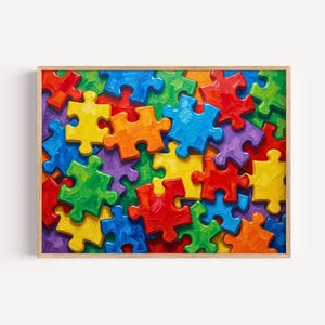 May include: A framed print featuring a vibrant, colorful jigsaw puzzle design. The puzzle pieces are in various colors, including red, orange, yellow, green, blue, and purple. The artwork is set in a wooden frame, adding a classic touch to the piece.