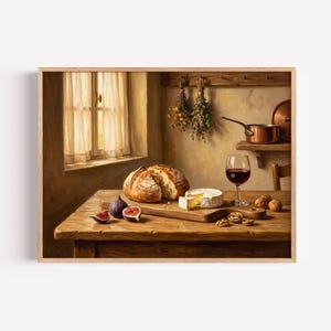 May include: A framed wall art print depicting a rustic wooden table with a loaf of crusty bread, a wheel of soft cheese, fresh figs, walnuts, and a glass of red wine. In the background, a window with sheer curtains and copper cookware.